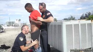 One cop holds the suspect back as the other cops enjoys the tasty treat of a big long black dick 2