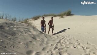 Tanned gay porn stars on the beach