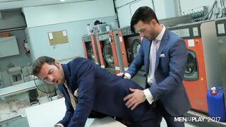 Two suited businessmen fuck hard in the factory 